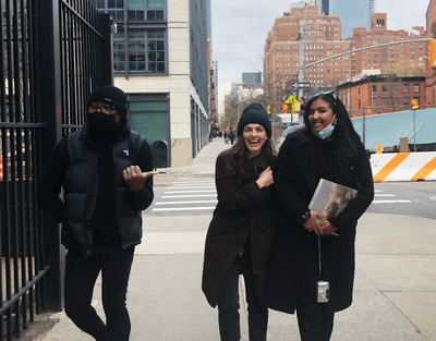 WCP staff Kenneth Montague, Maria Kanellopoulos and Emilie Croning walking down the street laughing and smiling